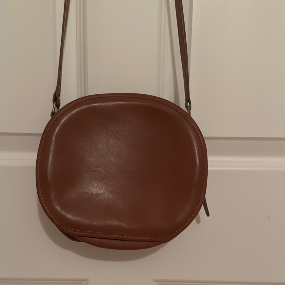 Coach tan leather circle shoulder or crossbody bag.